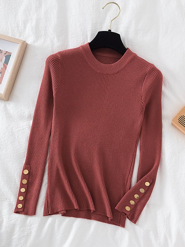 Pull col rond avec boutons dorés aux manches