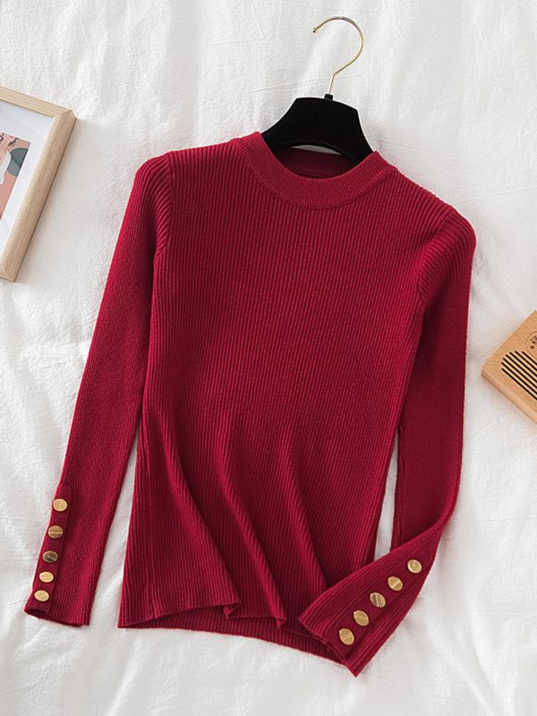 Pull col rond avec boutons dorés aux manches